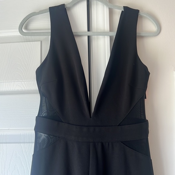 NWT - Vici Dolls Black Jumpsuit with Mesh Sides Flared Legs - Size L runs small - Picture 2 of 4